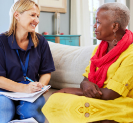 caregiver and elder woman talking