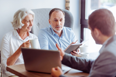 couple senior consulting with insurance agent