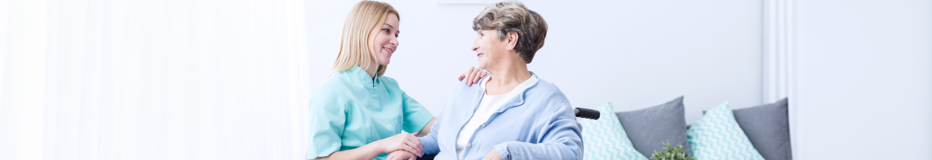 caregiver and elder woman talking