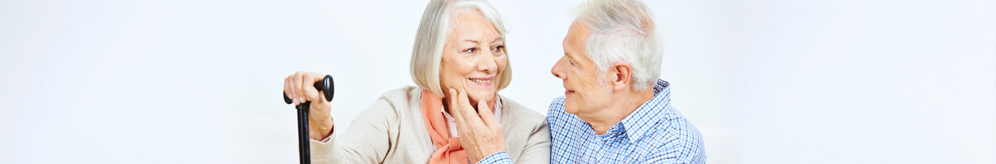 elderly couple smiling