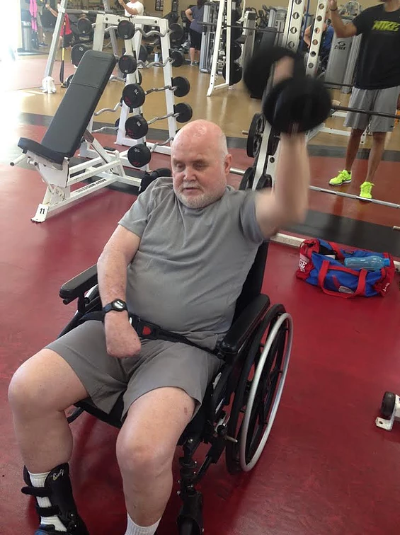 old man exercising or doing physical therapy