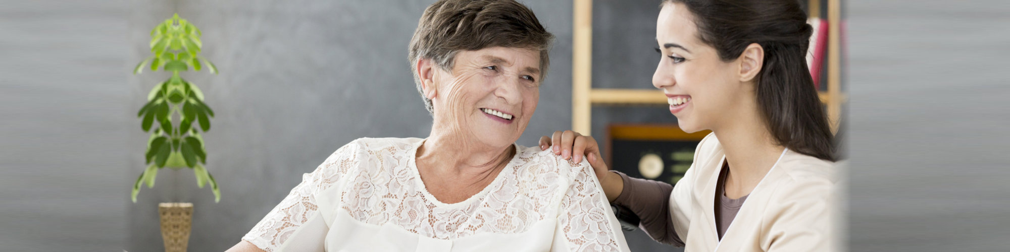 elder and caregiver smiling