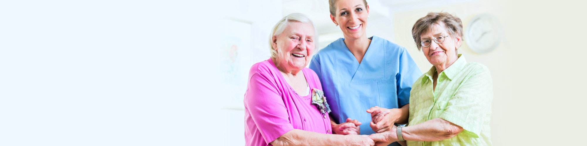 Elderly care nurse with two senior women